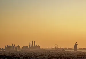 Elevated view towards Dubai Marina and Burj Al Arab Hotel at sunset, Dubai, United Elevated view towards Dubai Marina and Burj Al Arab Hotel at sunset, Dubai, United