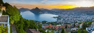 Elevated view over Lugano illuminated at sunset, Lake Lugano, Ticino, Switzerland Elevated view over Lugano illuminated at sunset, Lake Lugano, Ticino, Switzerland