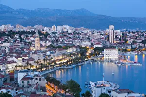 Elevevated view over Stari Grad & harbour illuminated at dusk, Split, Dalmatia, Croatia Elevevated view over Stari Grad & harbour illuminated at dusk, Split, Dalmatia, Croatia