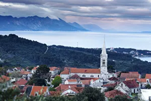Europe, Croatia, Dalmatia, Brac, Selca town with the Dinaric Alps behind Europe, Croatia, Dalmatia, Brac, Selca town with the Dinaric Alps behind