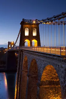 Evening illuminations on the Menai Bridge spanning the Menai Strait, North Wales, UK Evening illuminations on the Menai Bridge spanning the Menai Strait, North Wales, UK