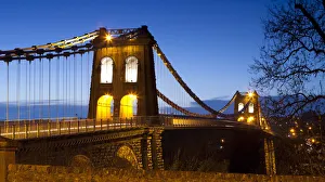 Evening illuminations on the Menai Suspension Bridge spanning the Menai Strait, Bangor Evening illuminations on the Menai Suspension Bridge spanning the Menai Strait, Bangor