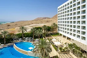 Exterior of hotel with swimming pool and palm trees, Ein Bokek, Southern District, Israel Exterior of hotel with swimming pool and palm trees, Ein Bokek, Southern District, Israel