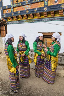 Female performers talking at a local festival in Paro District, Bhutan Female performers talking at a local festival in Paro District, Bhutan