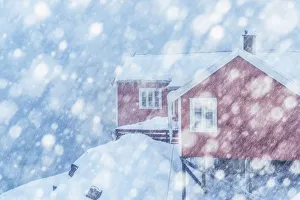 Fishermens houses (rorbuer) in Hamnoy during a snowfall, Lofoten islands, Norway Fishermens houses (rorbuer) in Hamnoy during a snowfall, Lofoten islands, Norway