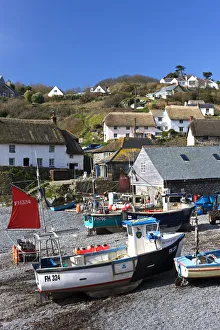 Fishing boats pulled onshore in the pretty Cornish fishing village of Cadgwith, Cornwall Fishing boats pulled onshore in the pretty Cornish fishing village of Cadgwith, Cornwall