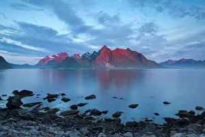 Flakstad Mountain Range illuminated by Midnight Sun, Lofoten Islands, Norway Flakstad Mountain Range illuminated by Midnight Sun, Lofoten Islands, Norway
