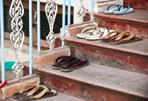 Myanmar Travel Destinations Prints: Flips flops outside monksaa dormitory, Mahagandayon Monastery, largest Buddhist monastery