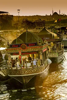 Floating restaurants boats near Galata Bridge at sunset, Istanbul, Turkey Floating restaurants boats near Galata Bridge at sunset, Istanbul, Turkey