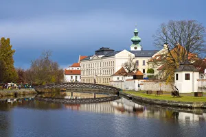 Footbridge over the Blind Shoulder of the Malse river named Muselak and tower of Dominican Monastery, Ceske Budejovice Footbridge over the Blind Shoulder of the Malse river named Muselak and tower of Dominican Monastery, Ceske Budejovice