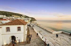 The fortress of the coastal fishing village of Sesimbra and the beach. Portugal The fortress of the coastal fishing village of Sesimbra and the beach. Portugal