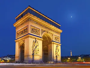 France, Paris, Arc de Triomphe and Eiffel Tower illuminated at night France, Paris, Arc de Triomphe and Eiffel Tower illuminated at night