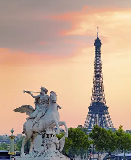 France, Paris, Jardin de Tuileries, statue and Eiffel Tower in the background at dusk France, Paris, Jardin de Tuileries, statue and Eiffel Tower in the background at dusk