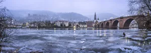 Frozen Neckar river and old town of Heidelberg in winter, Baden-Wurttemberg, Germany Frozen Neckar river and old town of Heidelberg in winter, Baden-Wurttemberg, Germany