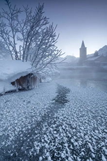 The frozen river Inn framed by mist and snow at dawn Sils Canton of Graubunden Engadine The frozen river Inn framed by mist and snow at dawn Sils Canton of Graubunden Engadine