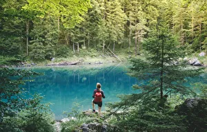 A girl on the shore of Eibsee, Garmisch Partenkirchen, Bayern Alps, Germany (MR) A girl on the shore of Eibsee, Garmisch Partenkirchen, Bayern Alps, Germany (MR)