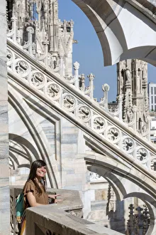 Girl smiling near spires of Milan Cathedral, Lombardy, Italy Girl smiling near spires of Milan Cathedral, Lombardy, Italy