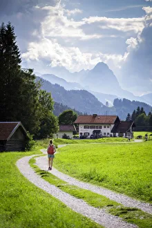 A girl walking on the path to Gerold Village, near Garmisch Partenkirken, Bayern Alps A girl walking on the path to Gerold Village, near Garmisch Partenkirken, Bayern Alps