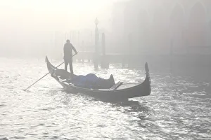 Gondola across the Grand Canal due to fog, Venice, Veneto, Italy Gondola across the Grand Canal due to fog, Venice, Veneto, Italy