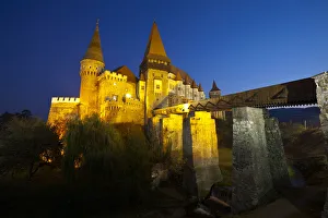 Hunyadi Castle or Corvins Castle illuminated at dusk, Hunedoara, Transylvania Hunyadi Castle or Corvins Castle illuminated at dusk, Hunedoara, Transylvania