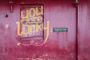 India, Kerala, Cochin - Kochi, Mattancherry, red building with You are lucky painted India, Kerala, Cochin - Kochi, Mattancherry, red building with You are lucky painted