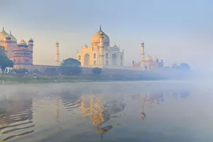 India, Taj Mahal reflecting in the Yamuna river on a foggy morning India, Taj Mahal reflecting in the Yamuna river on a foggy morning