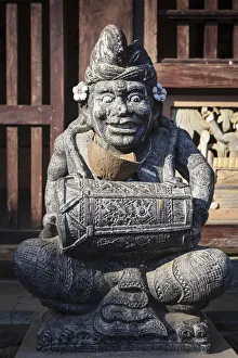 Indonesia, Bali, Tenganan Dau village. A stone statue of a spirit Indonesia, Bali, Tenganan Dau village. A stone statue of a spirit