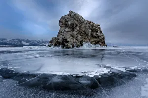 An island surrounded with flat ice over lake Baikal, Irkutsk region, Siberia, Russia An island surrounded with flat ice over lake Baikal, Irkutsk region, Siberia, Russia