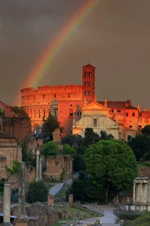 Italy, Rome, rainbow over Colosseum and Roman Forum at sunset Italy, Rome, rainbow over Colosseum and Roman Forum at sunset