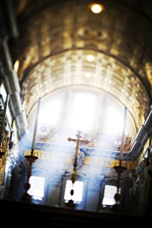 Italy, Rome, St. Peter Basilica interior with sun lights penetrating through the Italy, Rome, St. Peter Basilica interior with sun lights penetrating through the