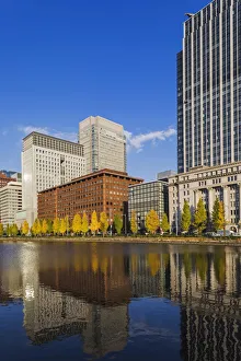 Japan, Honshu, Tokyo, Marunouchi, Hibiya-dori and Marunouchi Area Skyline Reflected