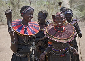 Jovial Pokot women celebrate an Atelo ceremony. The Pokot are pastoralists speaking a Jovial Pokot women celebrate an Atelo ceremony. The Pokot are pastoralists speaking a