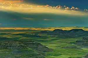 Canadian Travel Destinations Prints: Killdeer Badlands at sunset with approaching storm