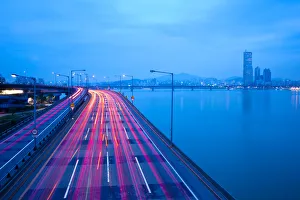 Korea, Seoul, Traffic on Expressway & Hanang River and 63 building on the right Korea, Seoul, Traffic on Expressway & Hanang River and 63 building on the right
