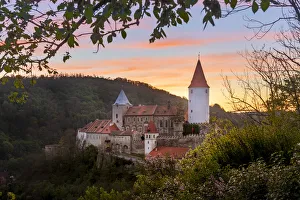 Krivoklat Castle amidst trees against sky during sunset, Krivoklat, Rakovnik District Krivoklat Castle amidst trees against sky during sunset, Krivoklat, Rakovnik District
