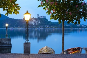 La Rocca fortress viewed from Arona at dusk, Lake Maggiore, Piedmont, Italy La Rocca fortress viewed from Arona at dusk, Lake Maggiore, Piedmont, Italy