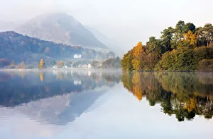 Lake Grasmere in the morning mist, Cumbria, UK Lake Grasmere in the morning mist, Cumbria, UK