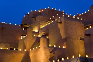 Peter Adams Photography Prints: Lanterns lighting adobe building, Santa Fe, New Mexico, USA