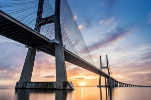 Lisbon, Portugal. Vasco Da Gama bridge at sunrise, the longest bridge in Europe Lisbon, Portugal. Vasco Da Gama bridge at sunrise, the longest bridge in Europe