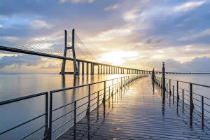 Lisbon, Portugal. Vasco Da Gama bridge at sunrise, the longest bridge in Europe Lisbon, Portugal. Vasco Da Gama bridge at sunrise, the longest bridge in Europe