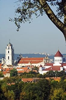 Prints of Lithuania, Vilnius. A view of St Johns Church and a 16th Century bell tower - part of Vilnius Unesco World Heritage Site Heritage Site Prints: Lithuania Print: St John's Church and 16th Century Bell Tower