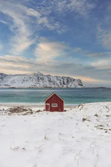 Lone cabin overlooking the fjord in the Lofoten islands, Norway Lone cabin overlooking the fjord in the Lofoten islands, Norway