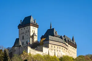 Low angle view of Karlstejn Castle against clear blue sky, Karlstejn, Beroun District, Central Bohemian Region Low angle view of Karlstejn Castle against clear blue sky, Karlstejn, Beroun District, Central Bohemian Region