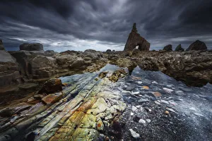 Low tide at Playa de Campiecho during a storm afternoon, Asturias, Spain Low tide at Playa de Campiecho during a storm afternoon, Asturias, Spain