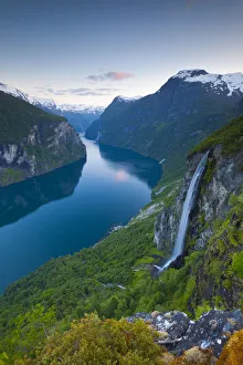 The Majestic Geiranger Fjord illuminated at dusk, Geiranger, More og Romsdal, Norway The Majestic Geiranger Fjord illuminated at dusk, Geiranger, More og Romsdal, Norway