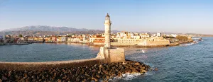 Majestic lighthouse overlooking the old harbour and colorful town of Chania, Crete Majestic lighthouse overlooking the old harbour and colorful town of Chania, Crete