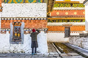 A man in Jambey Lhakhang, Jakar, Bumthang District, Bhutan A man in Jambey Lhakhang, Jakar, Bumthang District, Bhutan