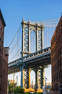 The Manhattan bridge with the Empire state building framed in the bridge, New York, USA The Manhattan bridge with the Empire state building framed in the bridge, New York, USA