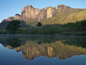 Massif de Tsaranora reflected in a river in the early morning Massif de Tsaranora reflected in a river in the early morning