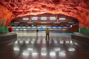 Men looking at artwork and paintings on rocks, Solna Centrum metro station, Stockholm Men looking at artwork and paintings on rocks, Solna Centrum metro station, Stockholm